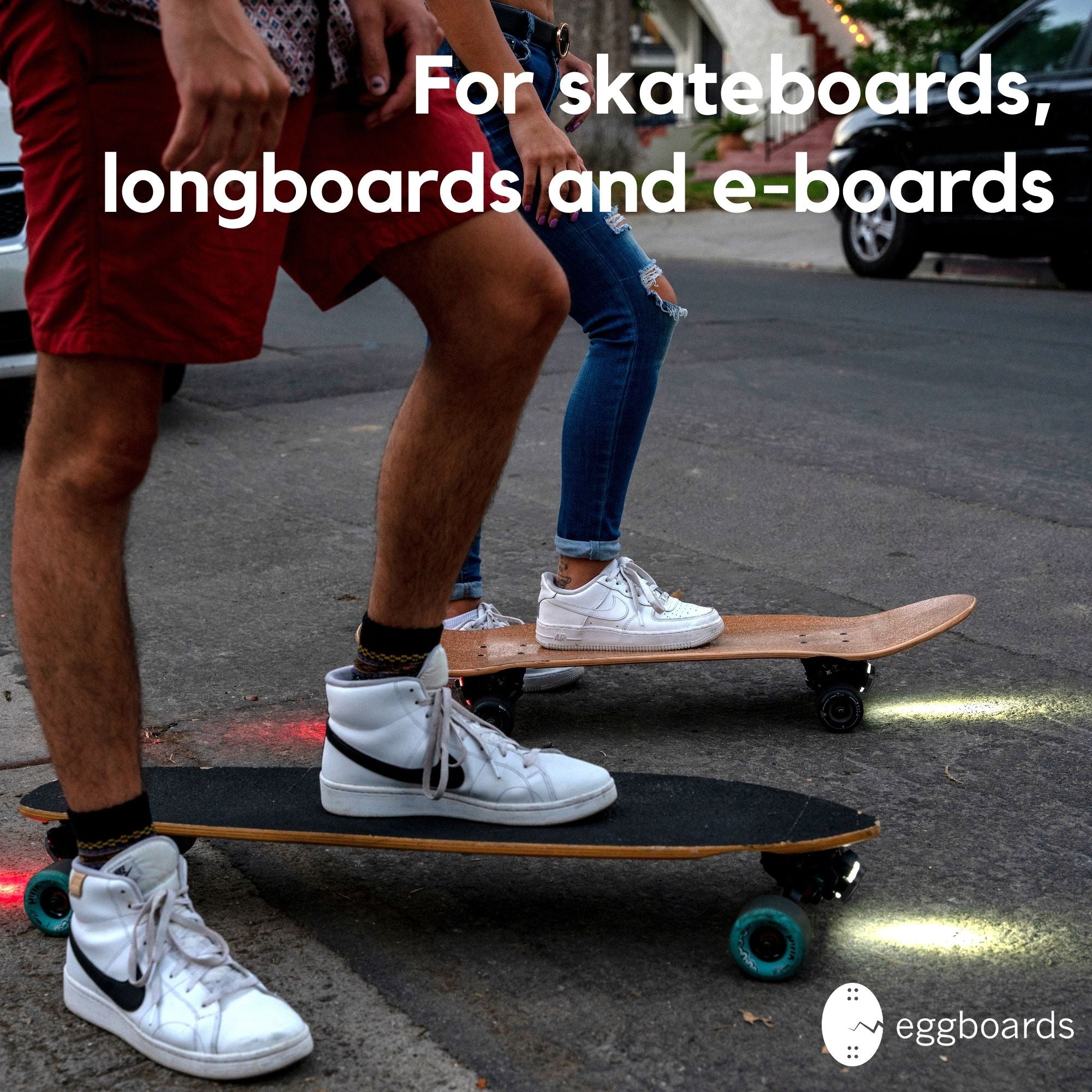 Two guys riding at night on a longboard and cruiser skateboard equipped with longboard skateboard lights, using Eggboard LED lights for enhanced visibility and safety.