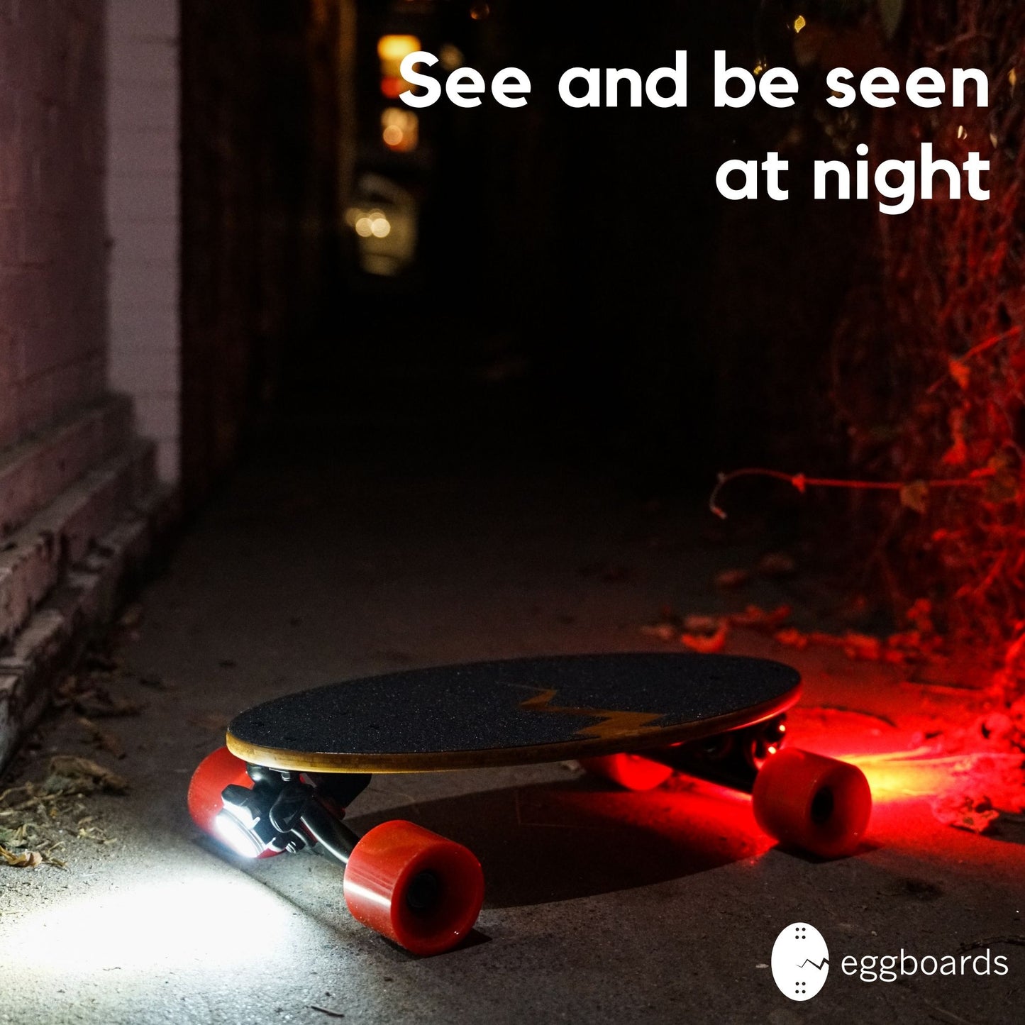 Eggboard cruiser skateboard with white and red LED lights installed, showcasing enhanced visibility for nighttime riding.