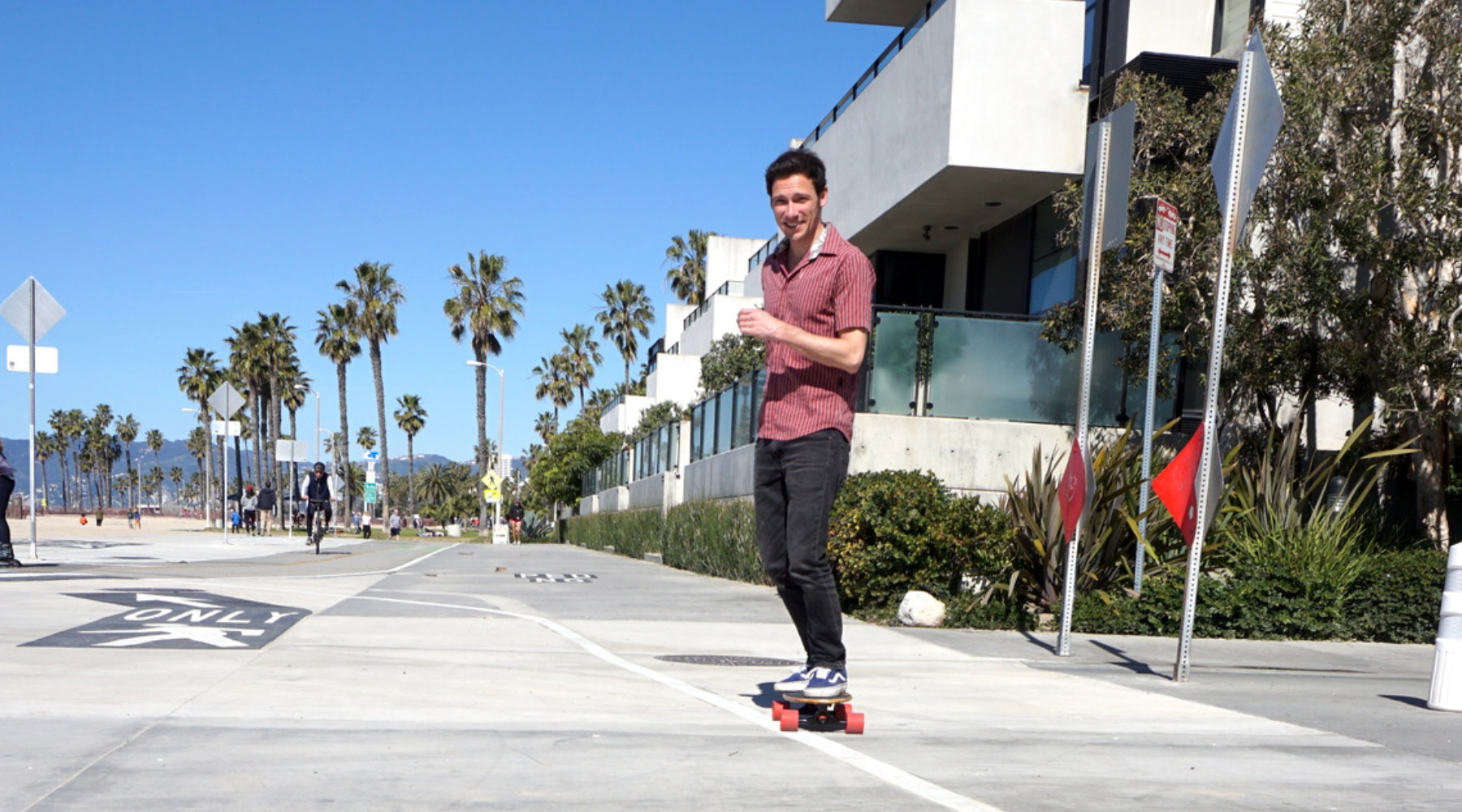 Guy Riding Eggboard in Venice Beach Boardwalk California